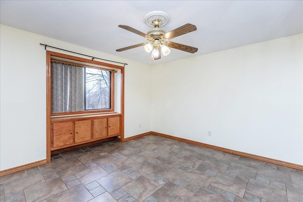 176 Maple Avenue, Unit 138 Rutland, MA 01543 - Photo 20 of 29 an empty room with windows and fan