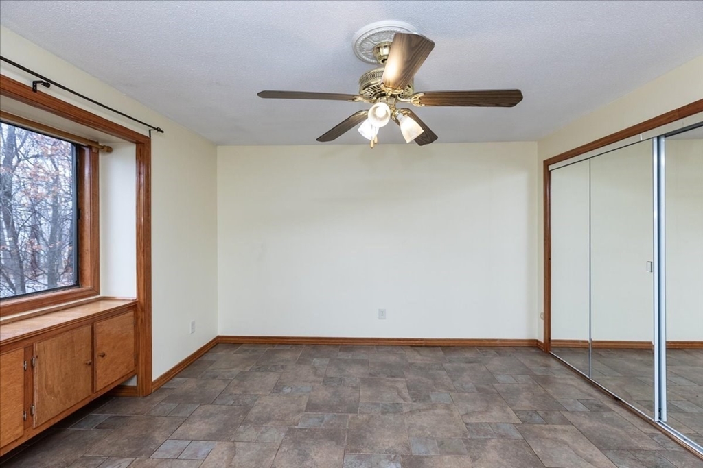 176 Maple Avenue, Unit 138 Rutland, MA 01543 - Photo 21 of 29 a view of an empty room with a window