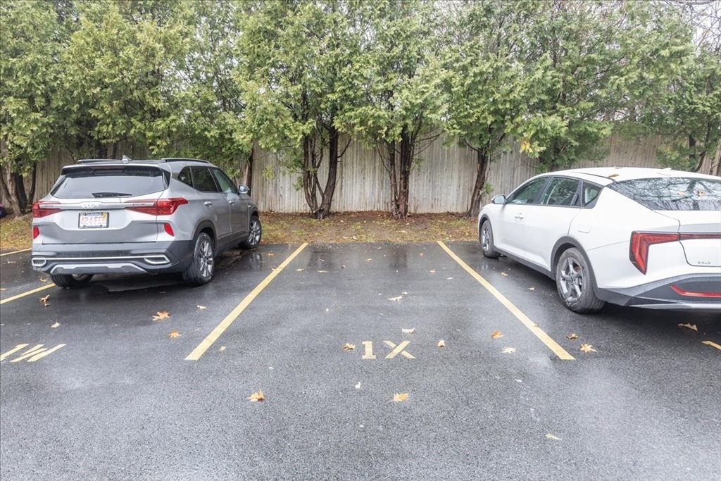 176 Maple Avenue, Unit 138 Rutland, MA 01543 - Photo 26 of 29 a car parked in parking