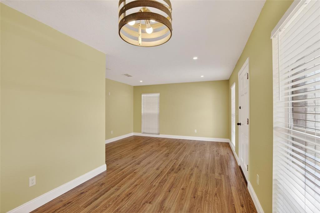 2340 Merrily Circle South Seffner, FL 33584 - Photo 8 of 52 a view of a room with wooden floor