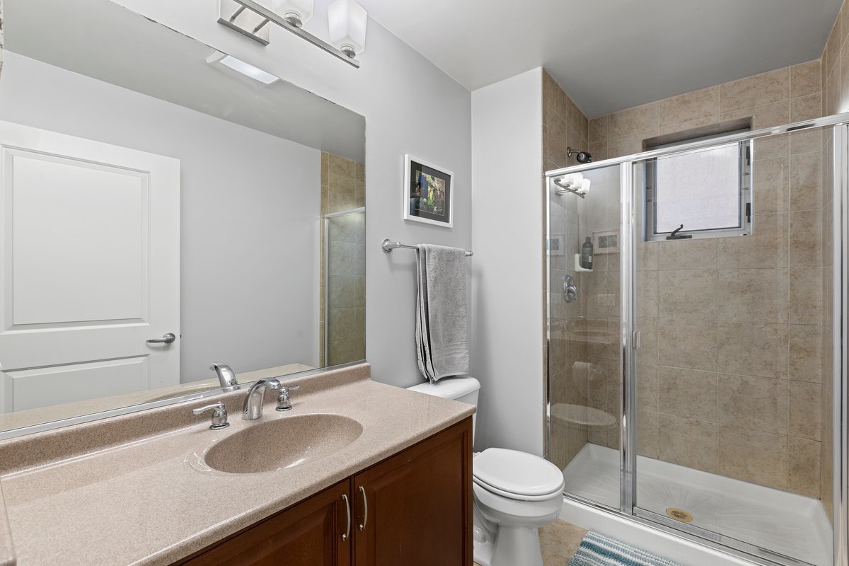 1159 North Hudson Avenue, Unit 6 Chicago, IL 60610 - Photo 12 of 24 a bathroom with a sink toilet and shower