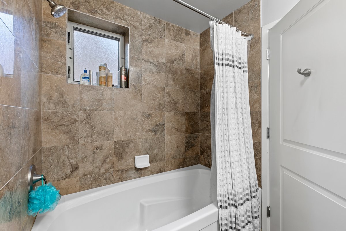 1159 North Hudson Avenue, Unit 6 Chicago, IL 60610 - Photo 17 of 24 a bathroom with a bathtub and shower
