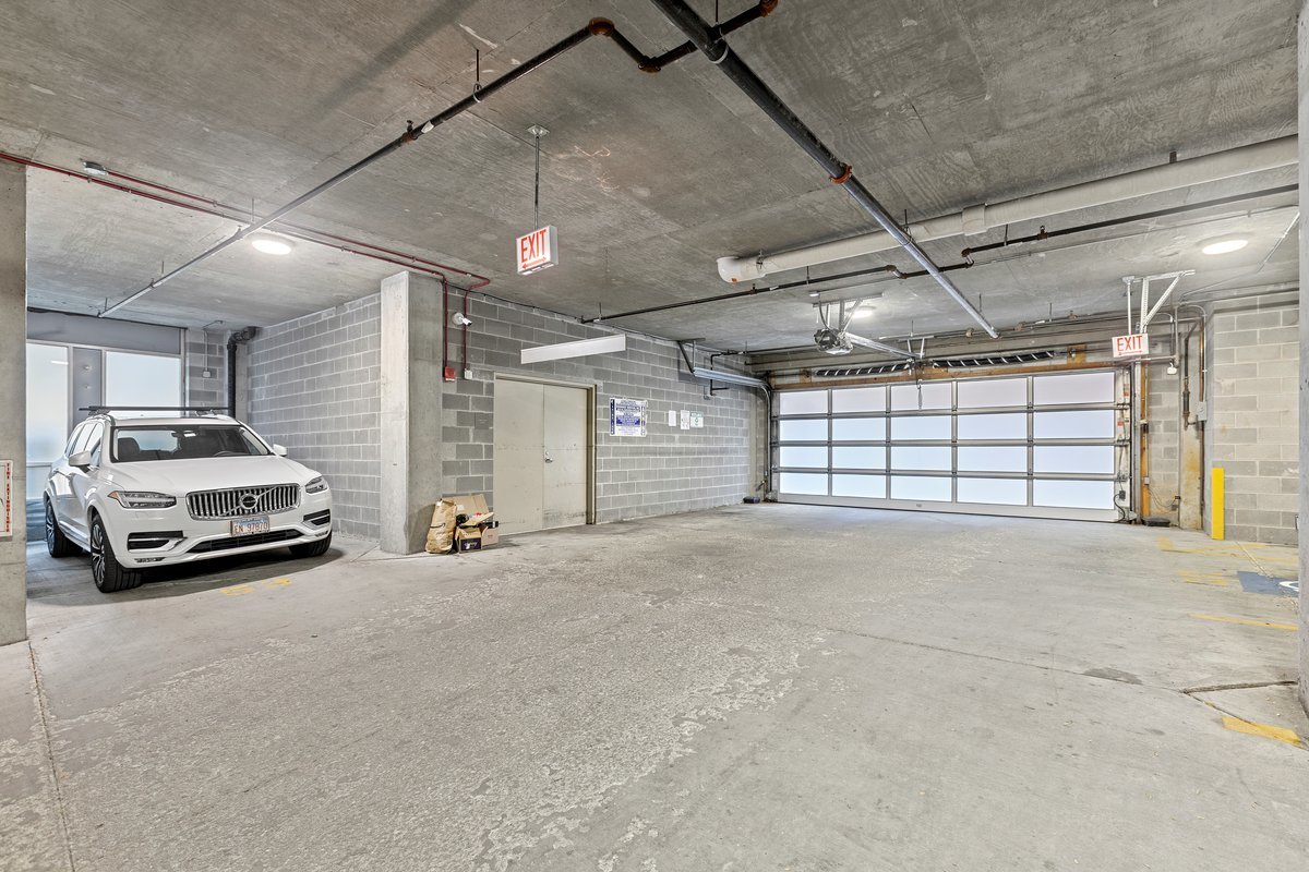1159 North Hudson Avenue, Unit 6 Chicago, IL 60610 - Photo 19 of 24 a view of parking garage with a car parked