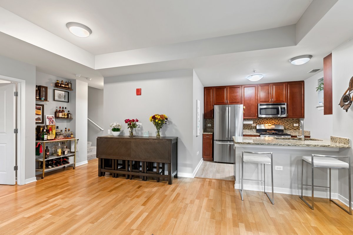 1159 North Hudson Avenue, Unit 6 Chicago, IL 60610 - Photo 5 of 24 a living room with furniture and a wooden floor