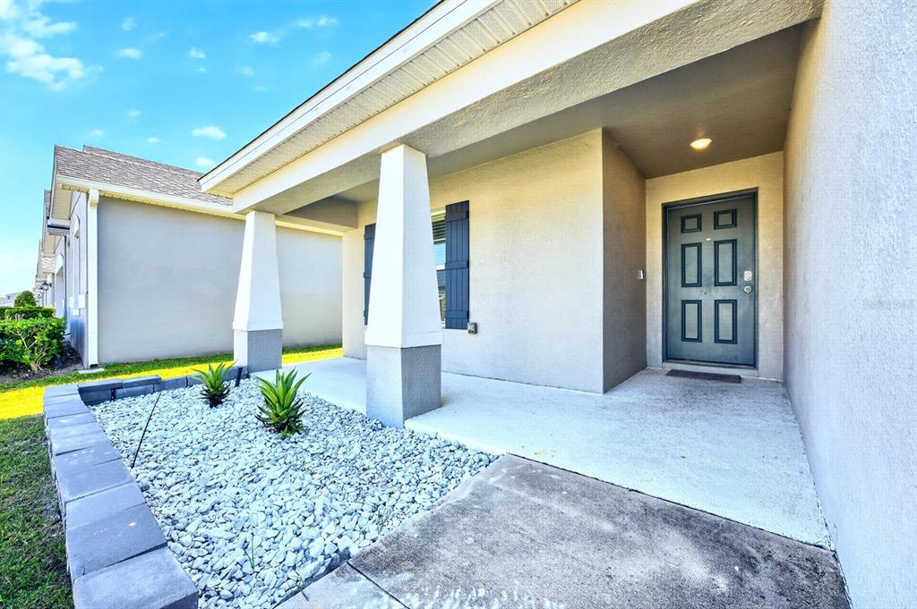 6348 Gardner Road Lakeland, FL 33813 - Photo 2 of 26 a front view of a house with a yard