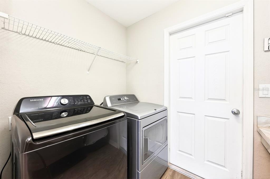 6348 Gardner Road Lakeland, FL 33813 - Photo 22 of 26 a view of storage and utility room with washer and dryer