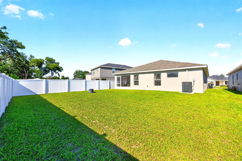 6348 Gardner Road Lakeland, FL 33813 - Photo 24 of 26 a view of a house with a backyard