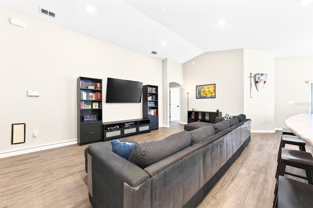 6348 Gardner Road Lakeland, FL 33813 - Photo 5 of 26 a living room with furniture and a flat screen tv