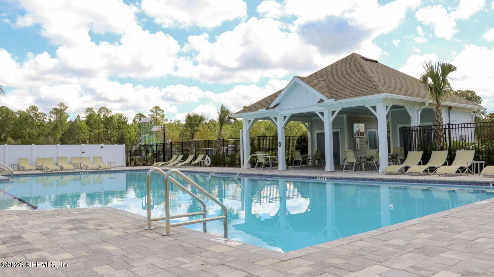 89 Kingsley Pk Way St. Augustine, FL 32084 - Photo 29 of 29 a view of a house with a yard and sitting area