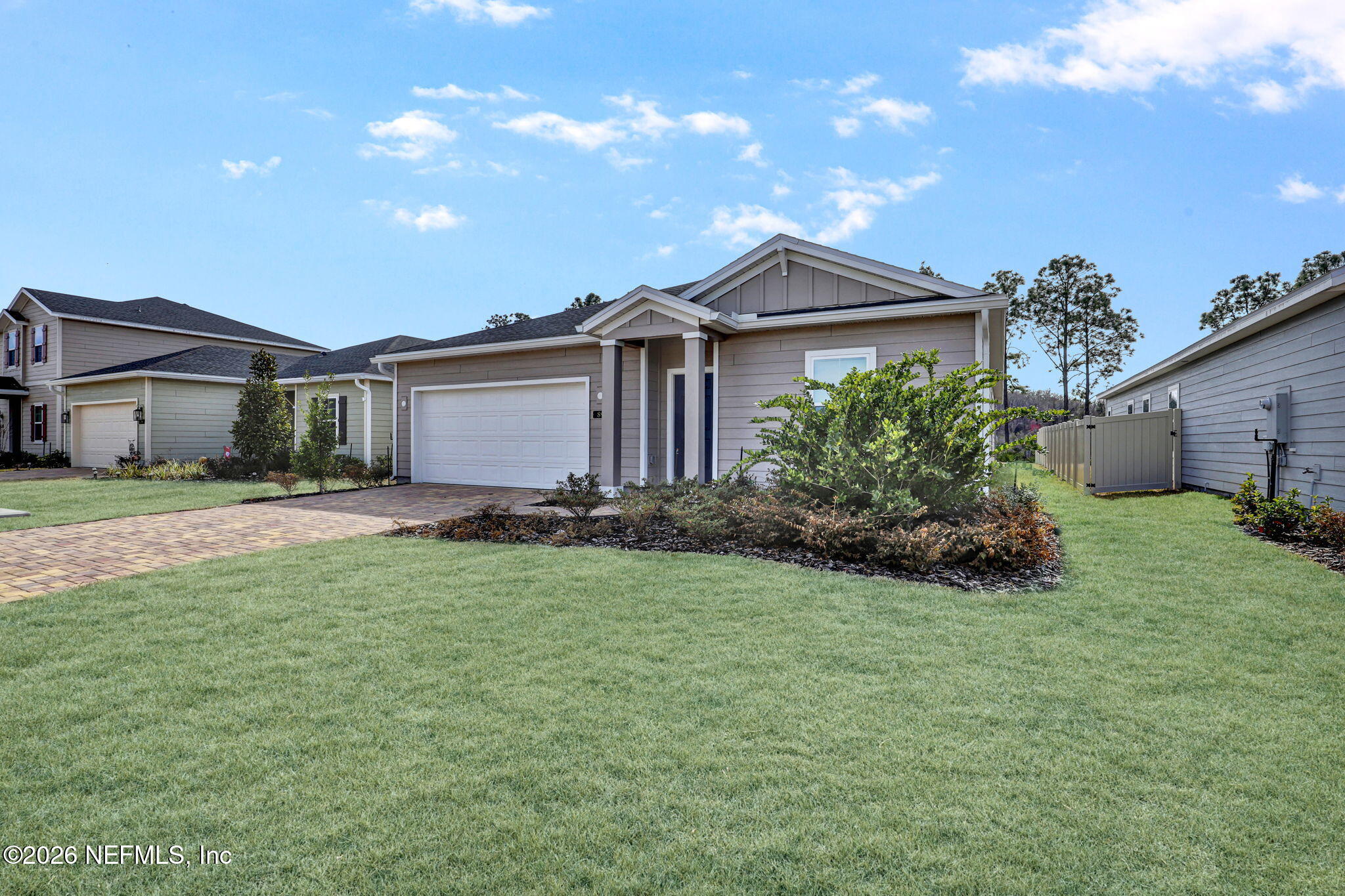 89 Kingsley Pk Way St. Augustine, FL 32084 - Photo 3 of 29 a view of a house with a big yard and potted plants