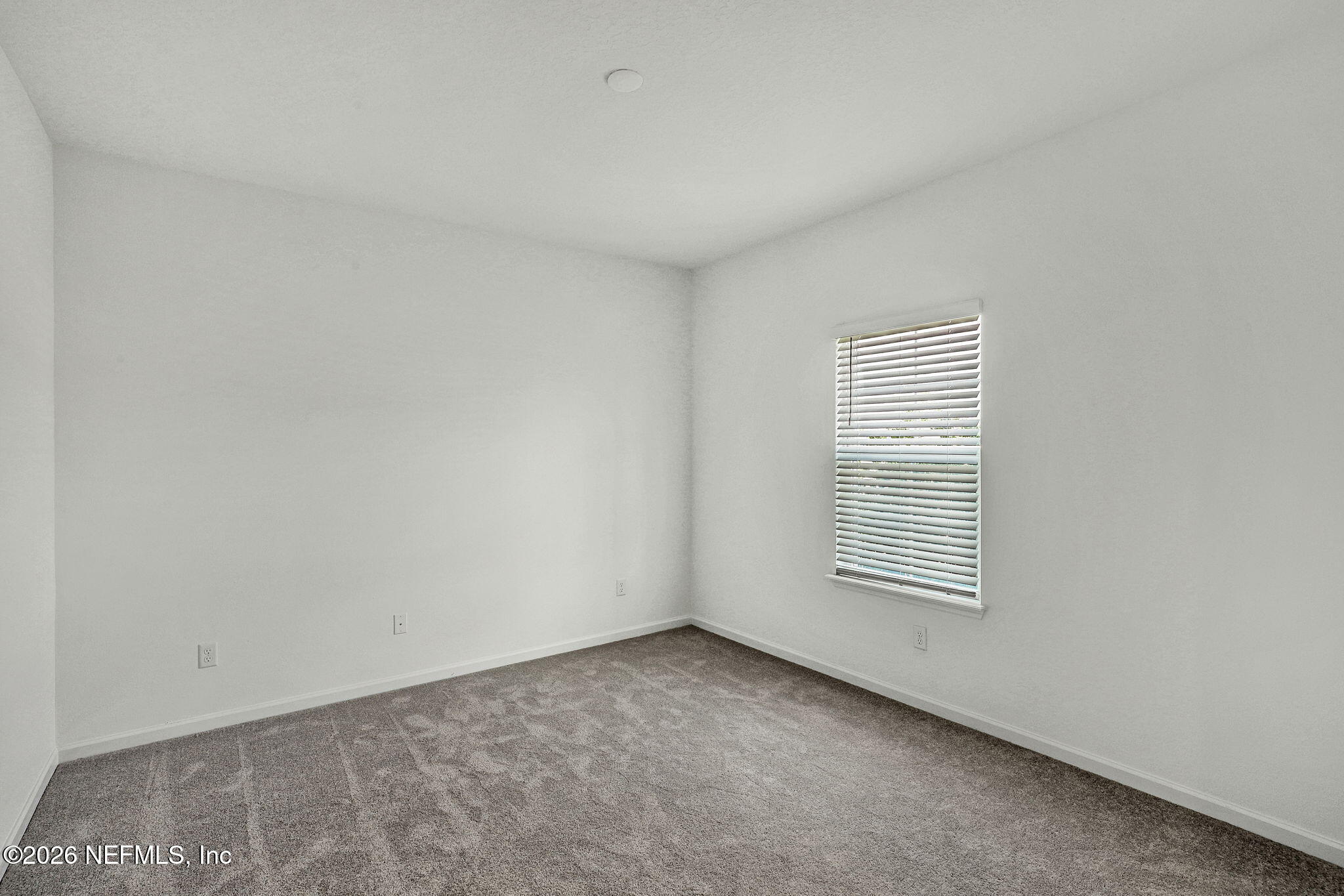 89 Kingsley Pk Way St. Augustine, FL 32084 - Photo 6 of 29 a view of an empty room with a window