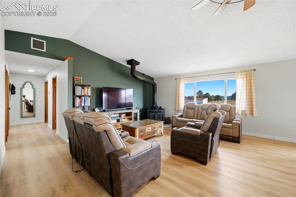 13815 Woodlake Road Elbert, CO 80106 - Photo 12 of 37 a living room with furniture and a flat screen tv
