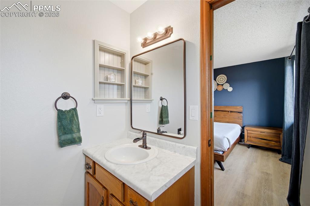 13815 Woodlake Road Elbert, CO 80106 - Photo 18 of 37 a bathroom with a sink and a mirror