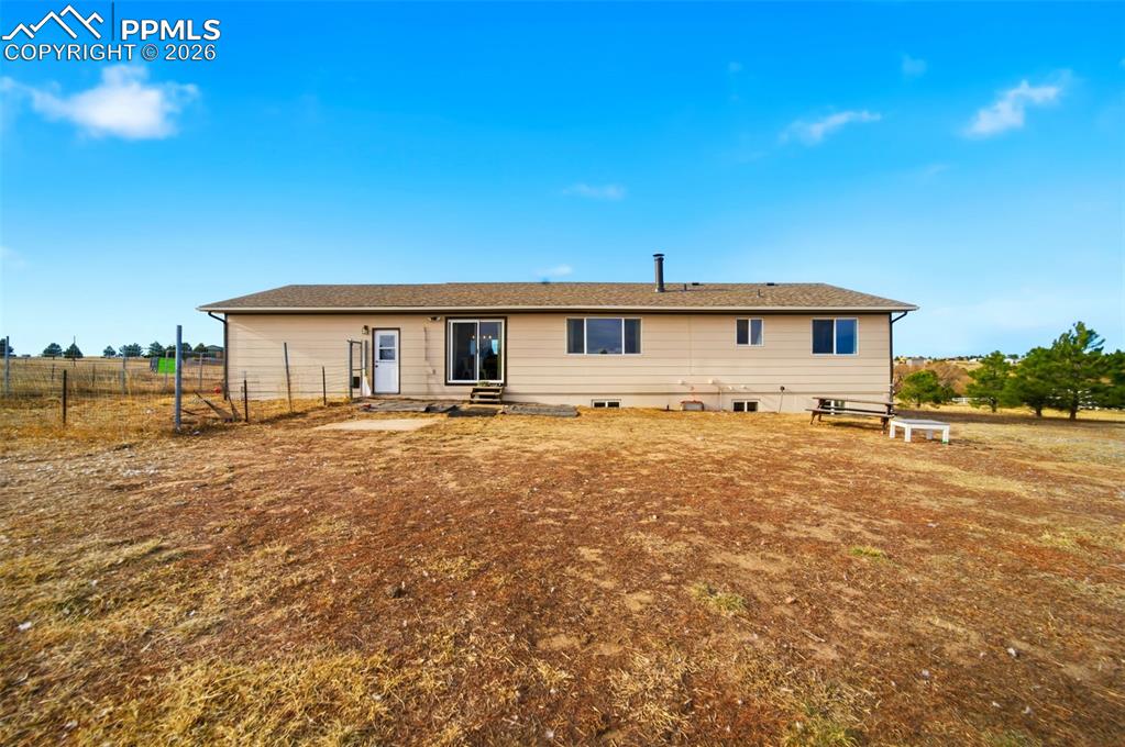 13815 Woodlake Road Elbert, CO 80106 - Photo 29 of 37 a front view of a house with a yard