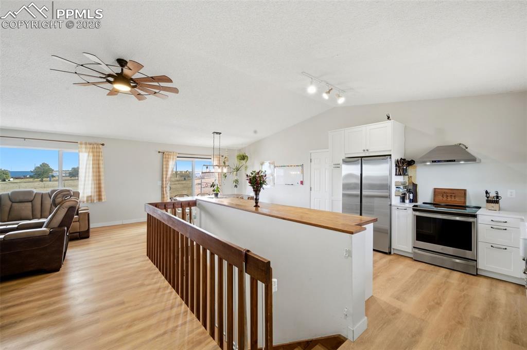 13815 Woodlake Road Elbert, CO 80106 - Photo 5 of 37 a view of a kitchen with kitchen island a counter top space a sink and appliances