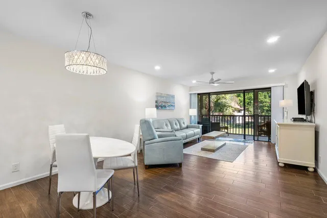 a living room with fireplace furniture and a wooden floor