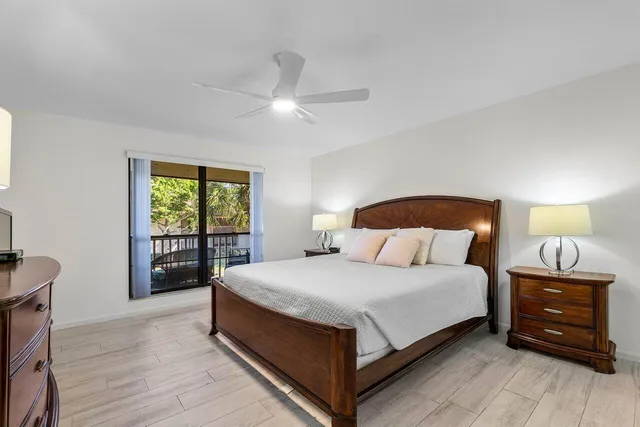 a bedroom with a bed and a tv on table