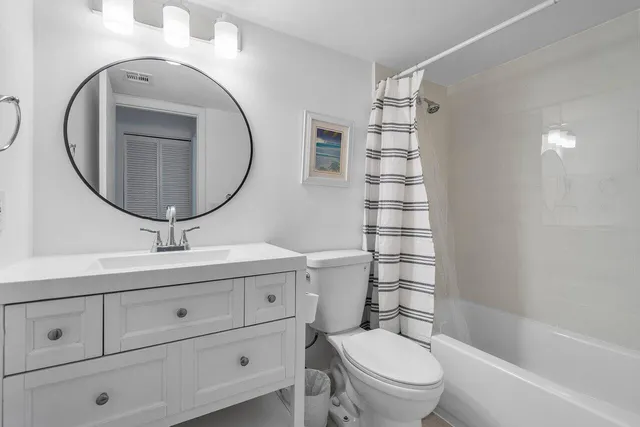 a balcony view with a large window