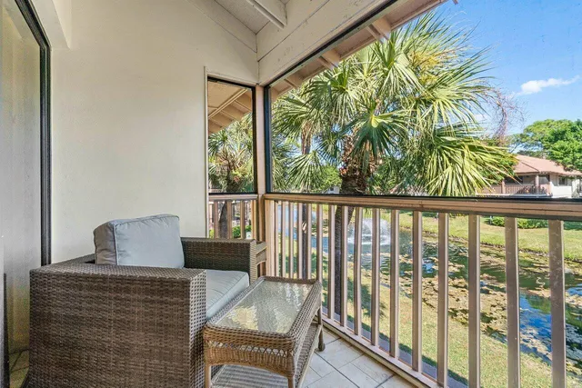 a view of balcony with furniture