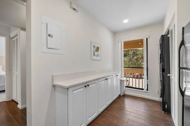 a view of a kitchen with dishwasher and a refrigerator