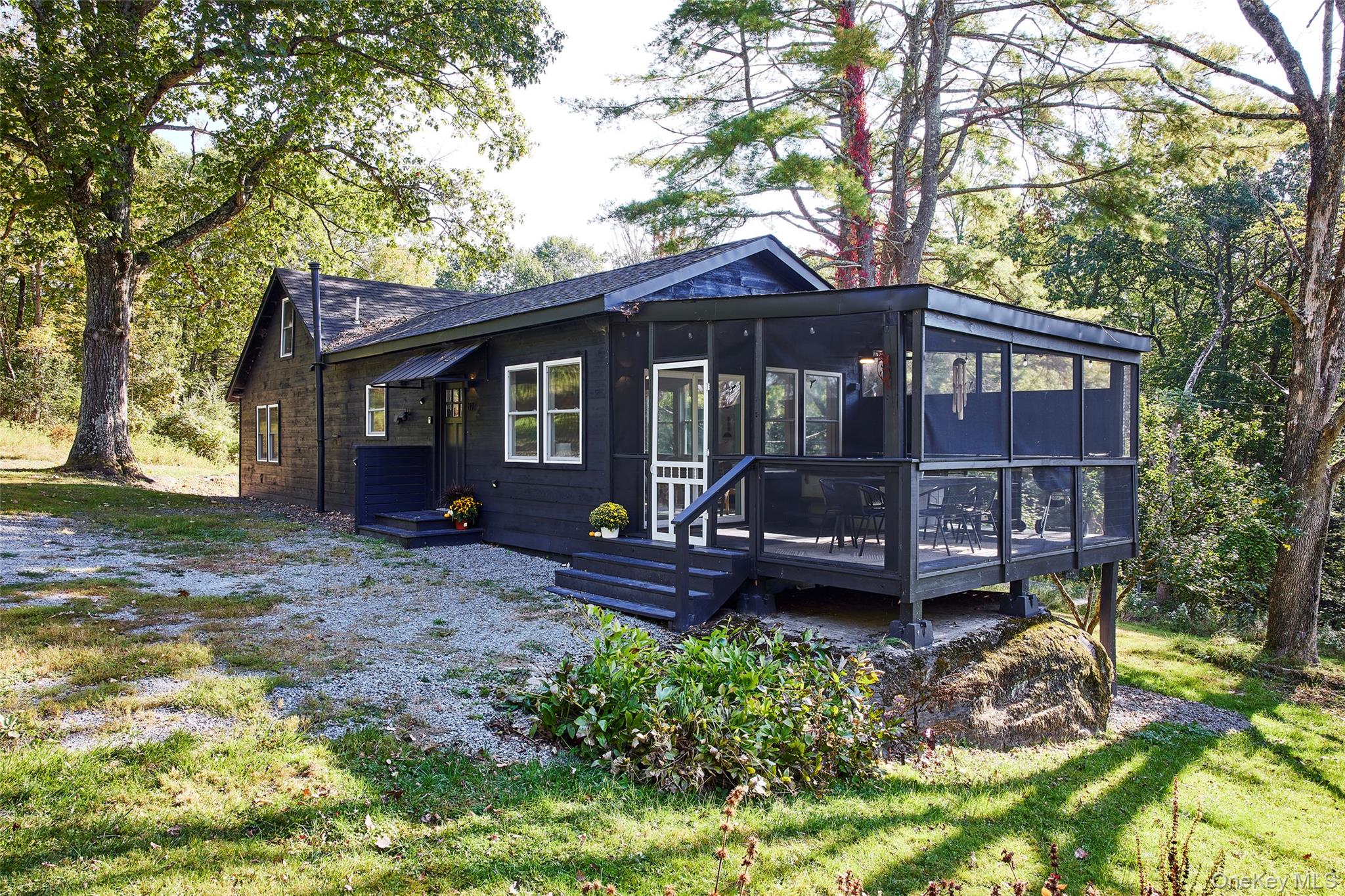 87 Hankins Road Hankins, NY 12741 - Photo 1 of 1 Back of property with a sunroom, a deck, and a lawn