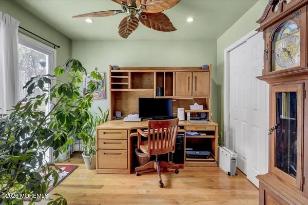 a workspace with furniture and wooden floor