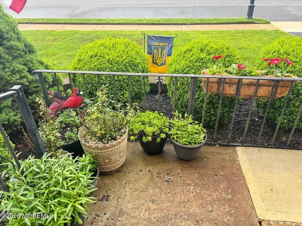 a view of a garden with sitting area