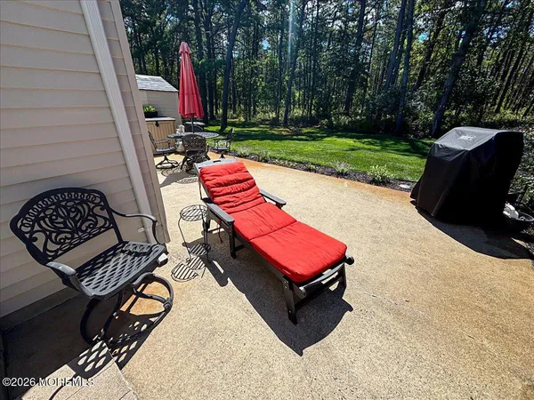 a view of a backyard with sitting area