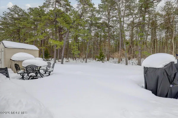 a view of a house with snow in front of it