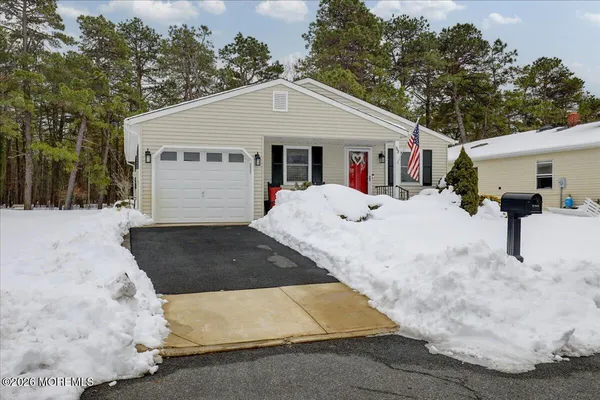 a view of house with outdoor space and sitting area