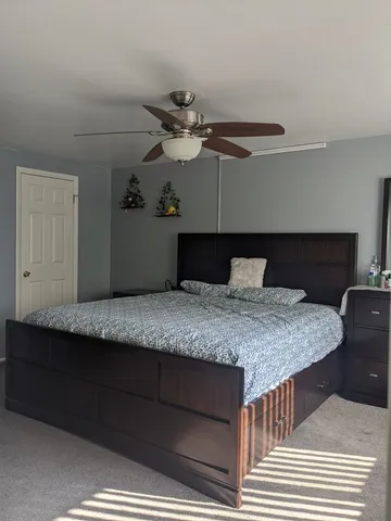 a bathroom with a sink mirror and cabinets