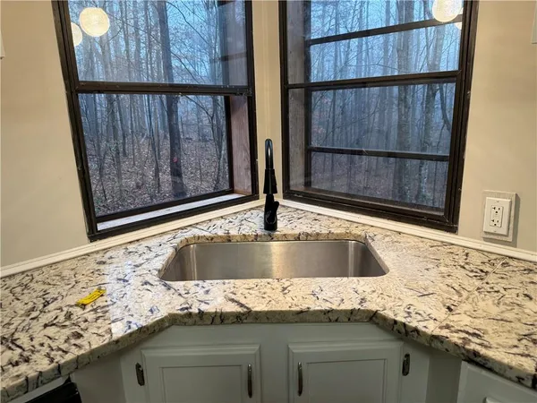 a view of wooden floor and door