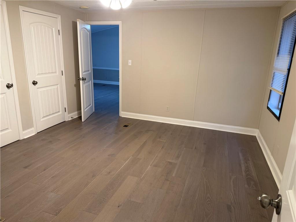 7 Poole Lane Talking Rock, GA 30175 - Photo 14 of 20 an empty room with wooden floor and closet