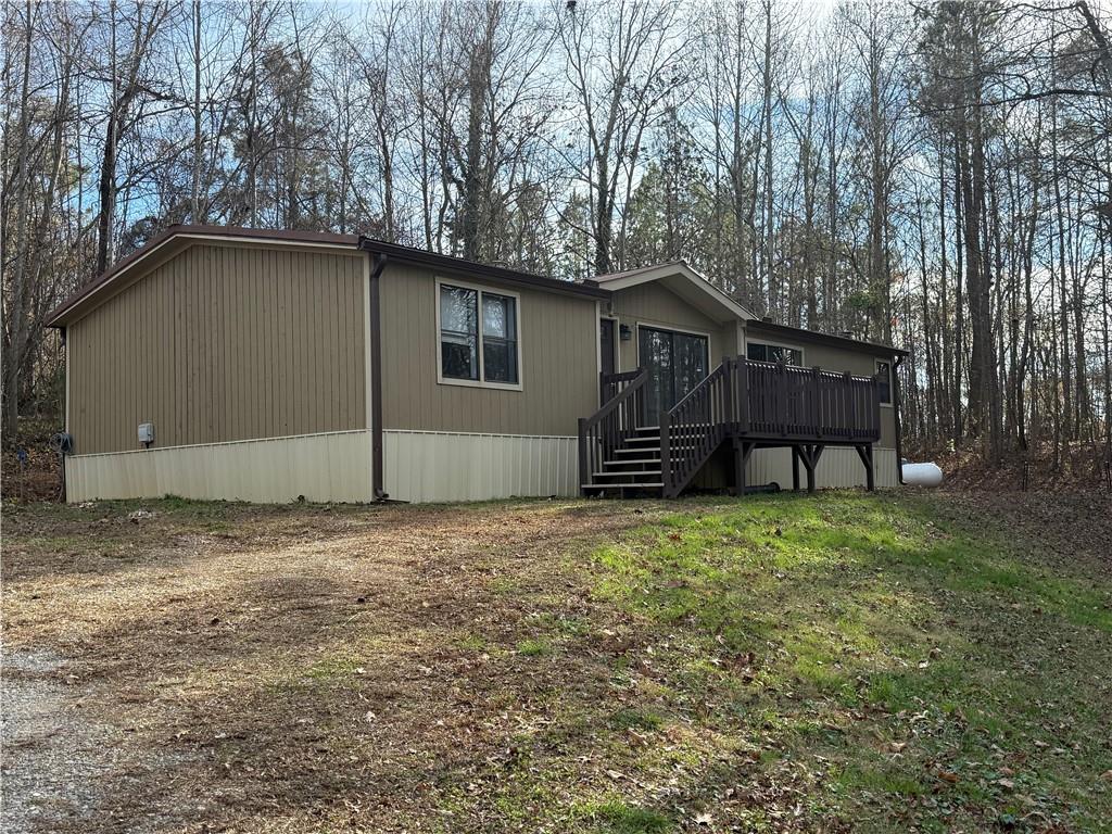 7 Poole Lane Talking Rock, GA 30175 - Photo 2 of 20 a house with trees in the background