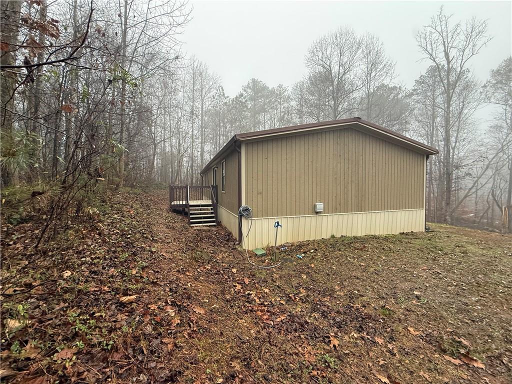 7 Poole Lane Talking Rock, GA 30175 - Photo 3 of 20 a backyard of a house with lots of green space