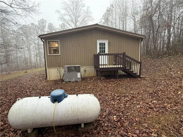 a view of a roof deck with table and chairs