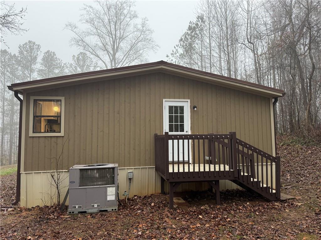 7 Poole Lane Talking Rock, GA 30175 - Photo 6 of 20 a view of a backyard with a tub