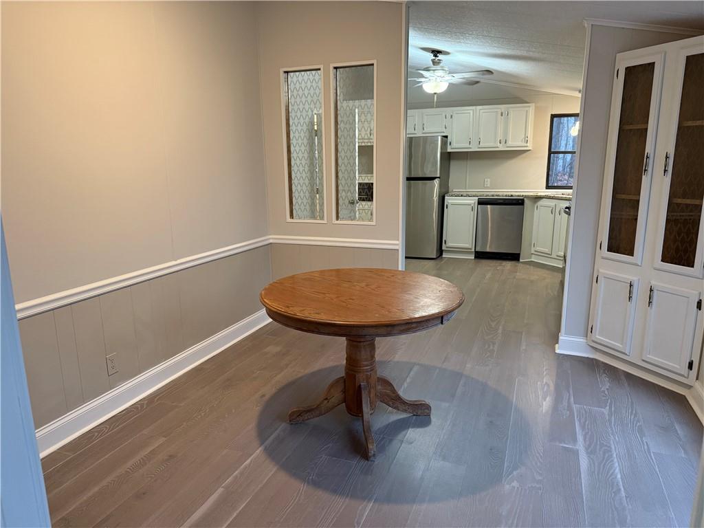 7 Poole Lane Talking Rock, GA 30175 - Photo 10 of 20 a room with wooden floor and a chandelier