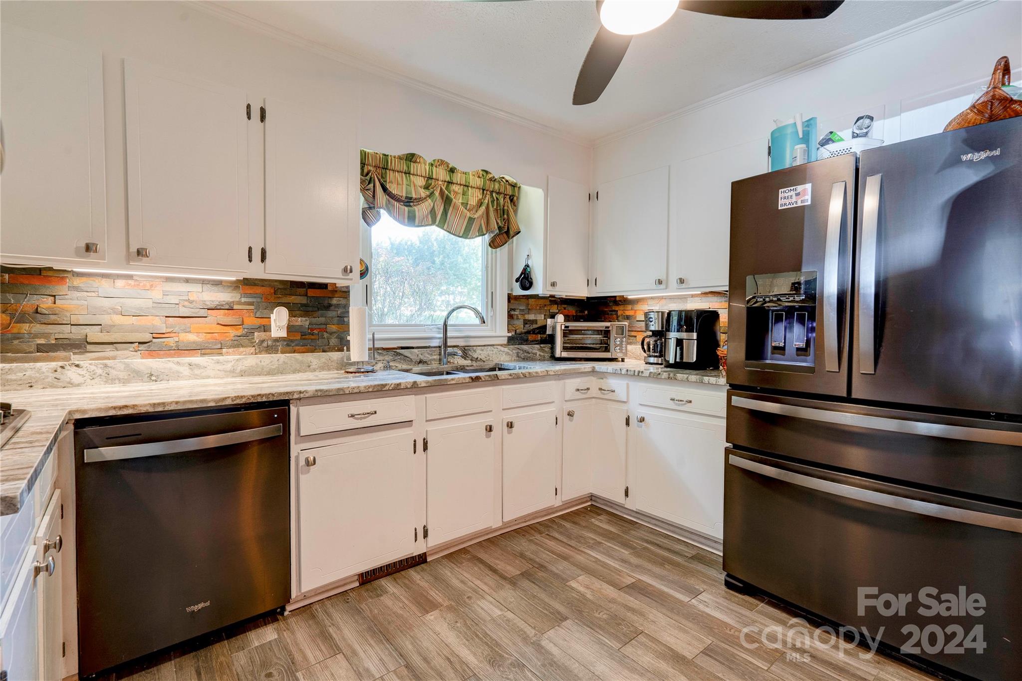 2352 Sheriff Allen Road Shelby, NC 28152 - Photo 12 of 48 a kitchen with granite countertop stainless steel appliances and wooden cabinets