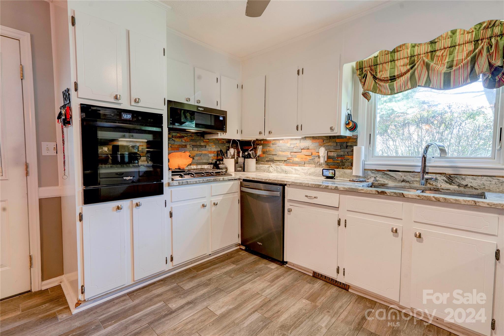 2352 Sheriff Allen Road Shelby, NC 28152 - Photo 14 of 48 a kitchen with granite countertop white cabinets and white appliances