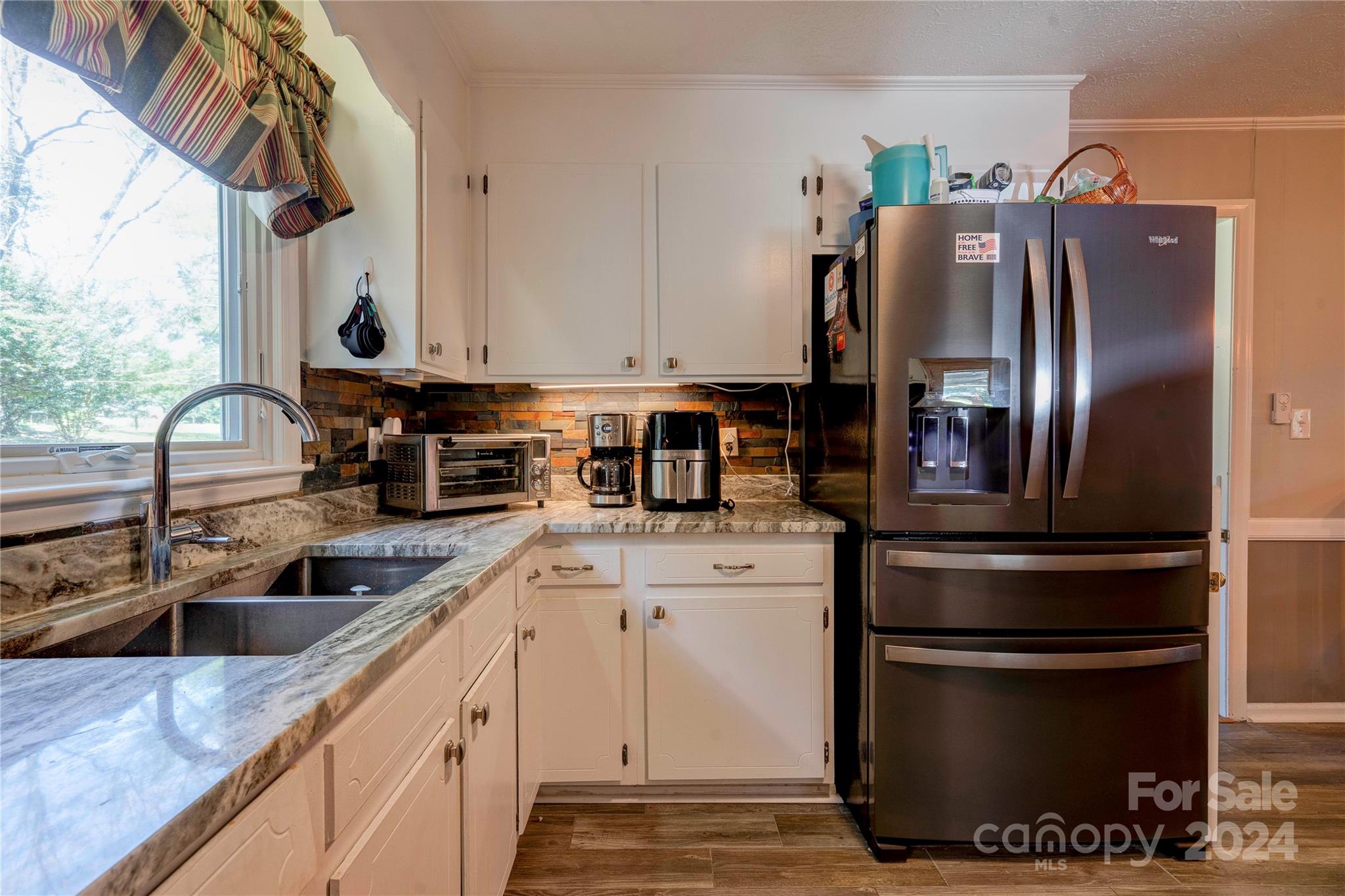 2352 Sheriff Allen Road Shelby, NC 28152 - Photo 15 of 48 a kitchen with stainless steel appliances granite countertop a sink a stove and a refrigerator