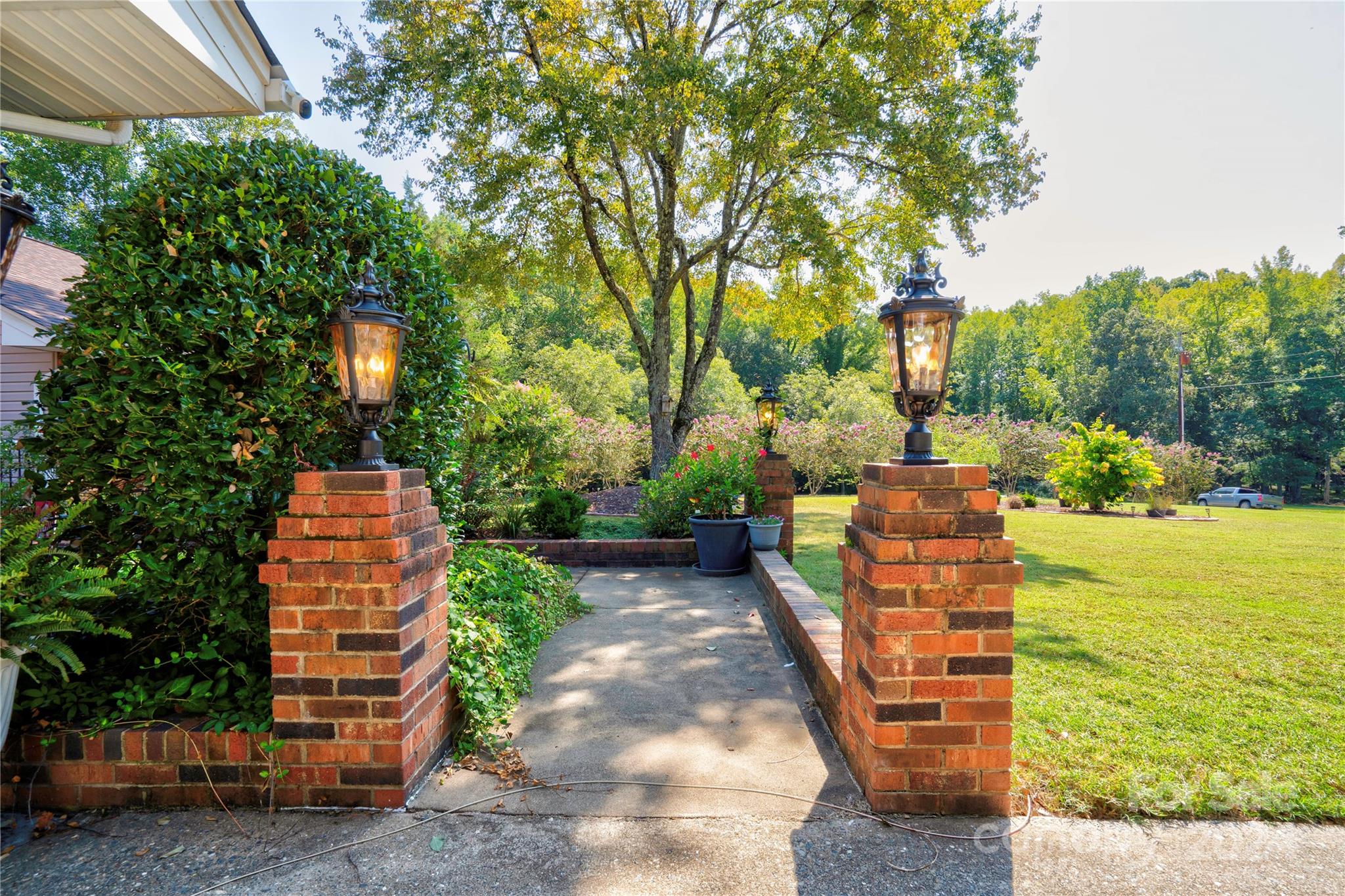 2352 Sheriff Allen Road Shelby, NC 28152 - Photo 3 of 48 a backyard of a house with large trees and plants