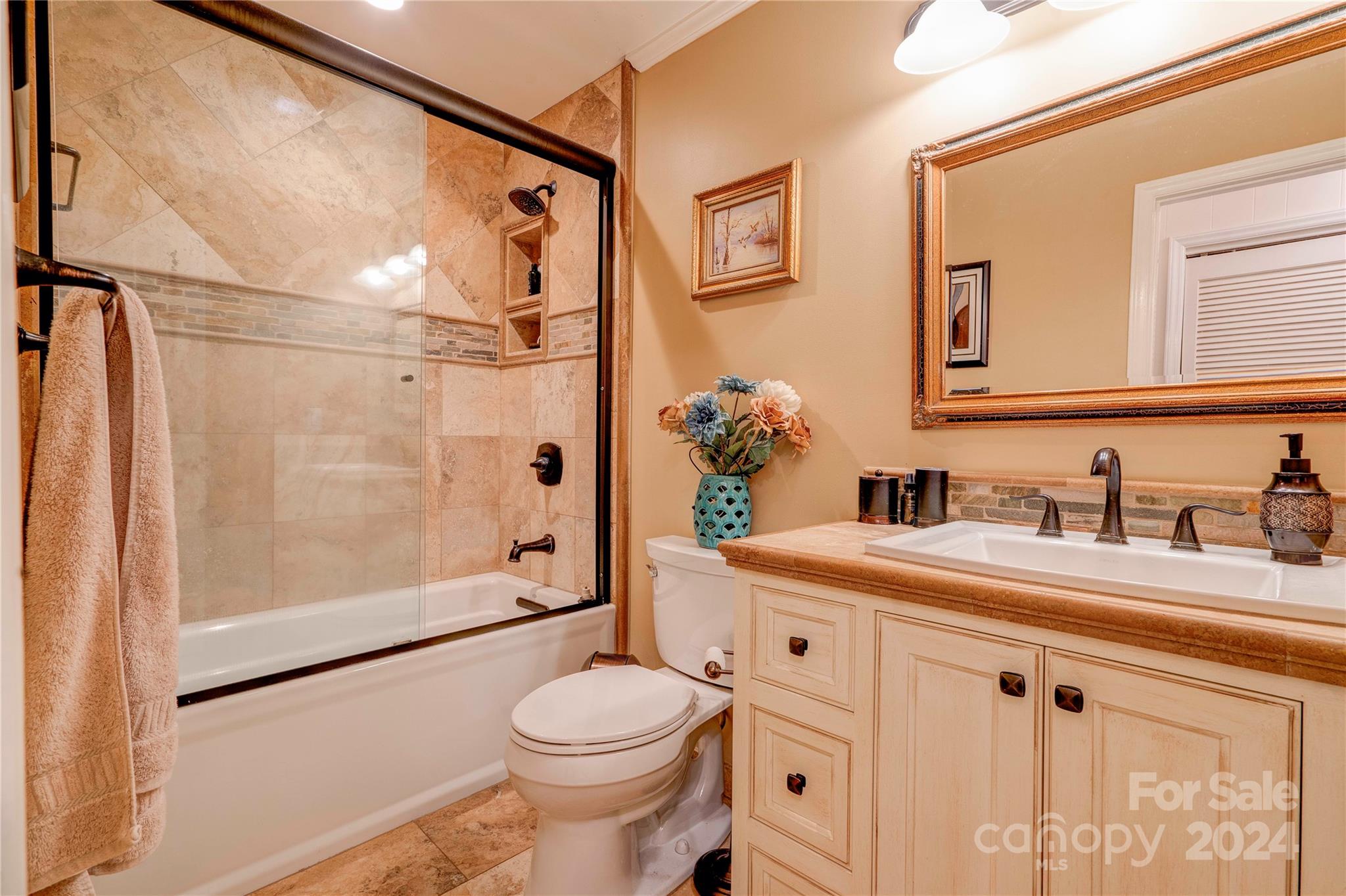 2352 Sheriff Allen Road Shelby, NC 28152 - Photo 31 of 48 a bathroom with a granite countertop sink mirror vanity shower and toilet