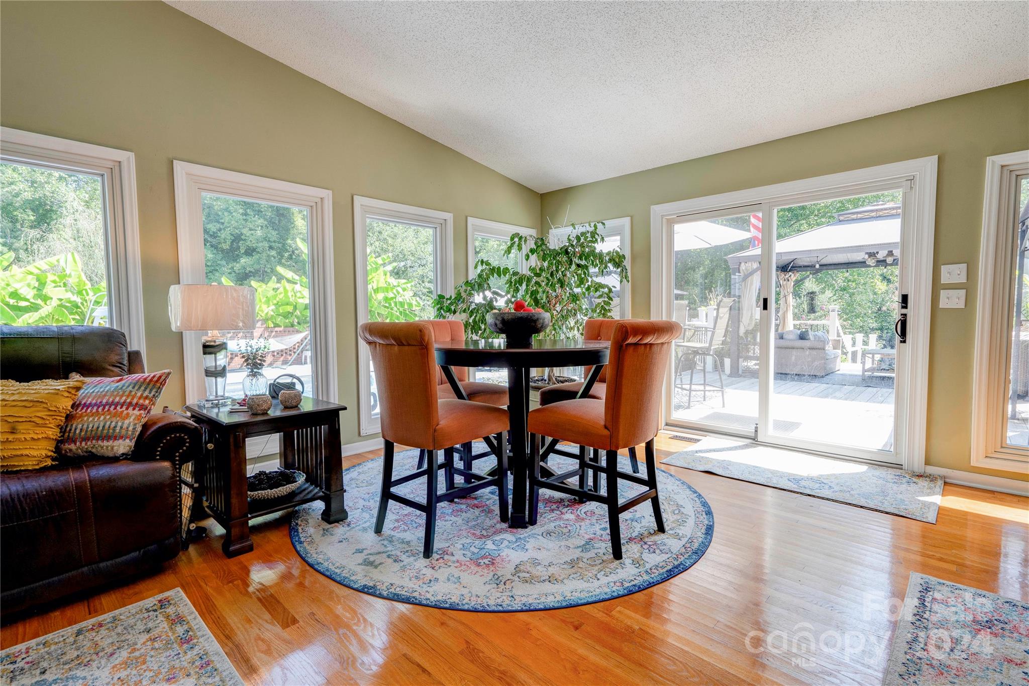 2352 Sheriff Allen Road Shelby, NC 28152 - Photo 38 of 48 a dining room with furniture a rug and a floor to ceiling window