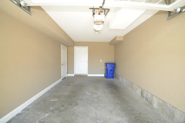 a view of empty room with a chandelier