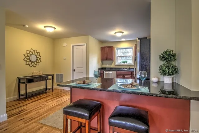 a dining room with furniture and window