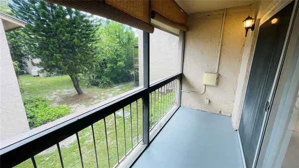 a bathroom with a bathtub with toilet