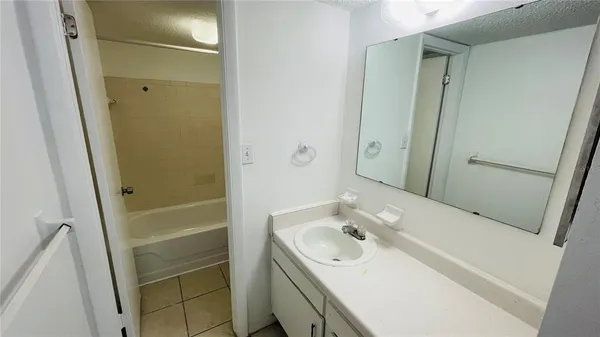 an empty room with wooden floor and closet