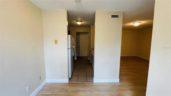 a kitchen with stainless steel appliances a refrigerator and a stove