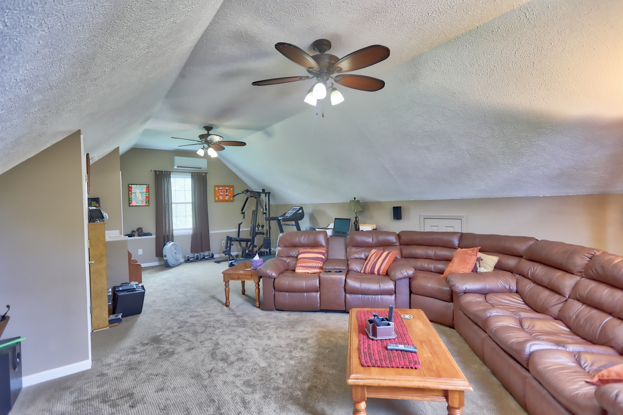 7696 South Swift Road Goodlettsville, TN 37072 - Photo 13 of 31 a living room with furniture a chandelier fan and a rug